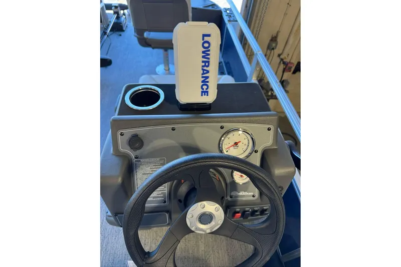 Slide: The Image of Steering console of 2026 Sun Tracker Bass Buggy 18 DLX with Lowrance device. - 12