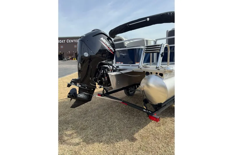 Slide: The Image of 2026 Sun Tracker Bass Buggy 18 DLX pontoon boat with Mercury outboard motor. - 8