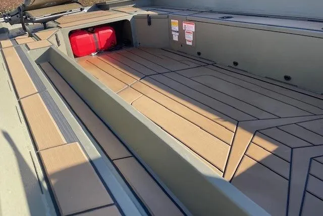 Slide: The Image of 2026 Tracker Grizzly 1756 T Marsh boat interior with wood-patterned flooring. - 43