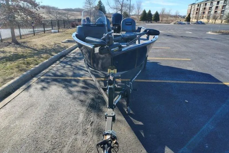 Slide: The Image of 2026 Tracker Pro Guide V-16 SC boat parked in a sunny lot. - 4