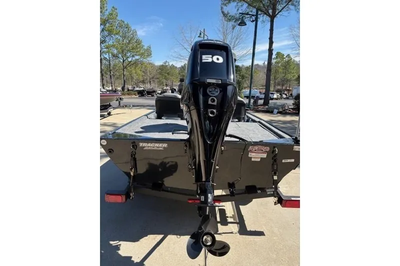 Slide: The Image of 2026 Tracker Bass Tracker Classic XL boat with 50 HP outboard motor, rear view. - 4