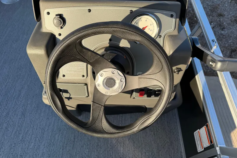 Slide: The Image of Steering console of 2026 Sun Tracker Bass Buggy 16 XL Select pontoon boat. - 2