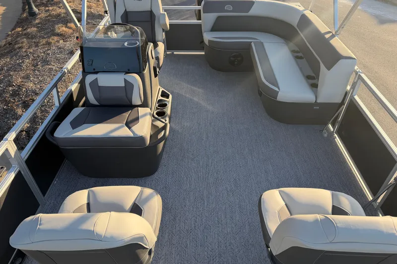 Slide: The Image of 2026 Sun Tracker Bass Buggy 16 XL Select pontoon boat interior with seating and helm. - 4