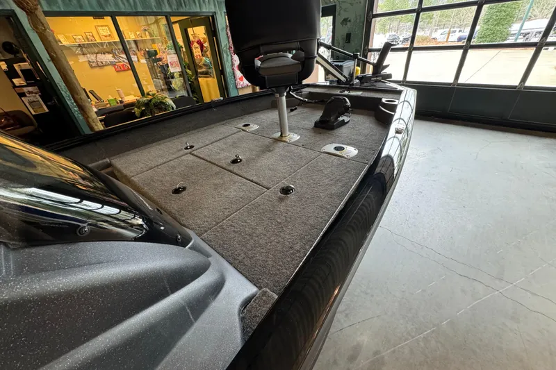 Slide: The Image of 2026 Tracker Pro Team 175 Crappie Edition boat interior with carpeted deck and seating. - 55