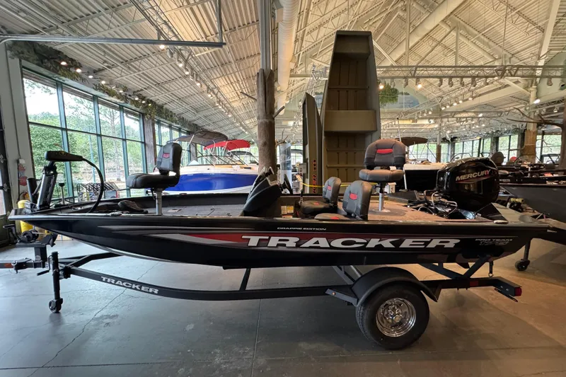 Slide: The Image of 2026 Tracker Pro Team 175 Crappie Edition boat displayed indoors. - 57