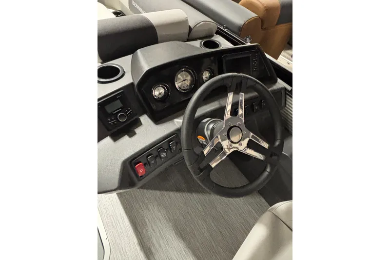 Slide: The Image of 2026 Bennington 22 S Swingback boat dashboard with steering wheel and control panel. - 8