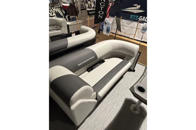 Slide: The Image of Bennington 22 S Swingback 2026, luxurious boat seating in gray and white. - 9
