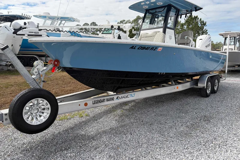 The Image of 2024 Sportsman Masters 267 Bay Boat on trailer, displayed outdoors. - 1