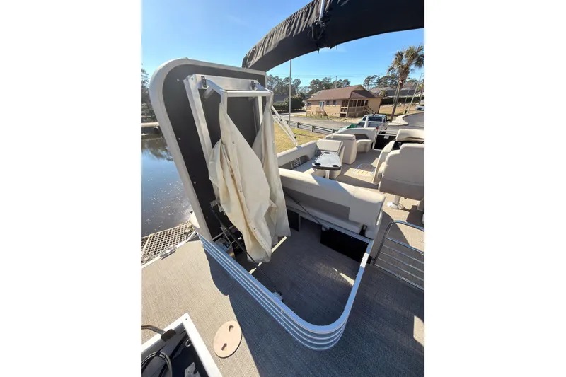 Slide: The Image of 2018 Bennington 23 SSBXP pontoon boat interior with seating and storage area. - 10