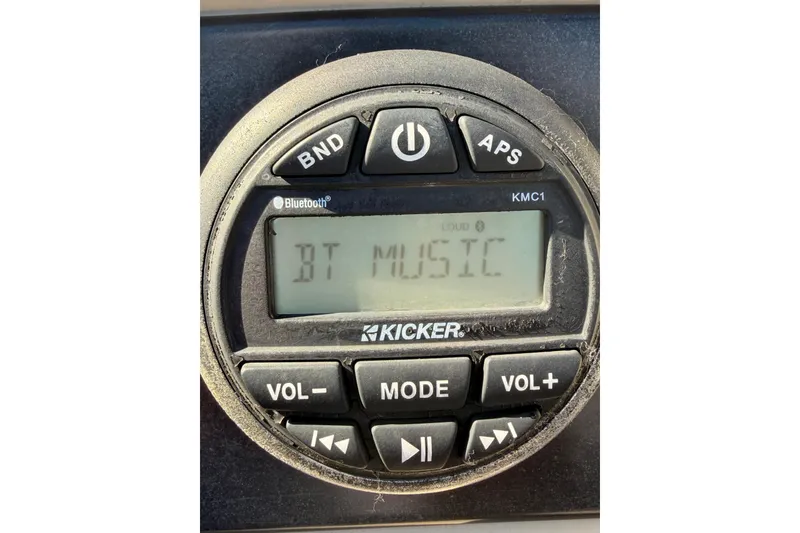 Slide: The Image of Kicker Bluetooth audio system displaying "BT Music" on a 2018 Bennington 23 SSBXP. - 17