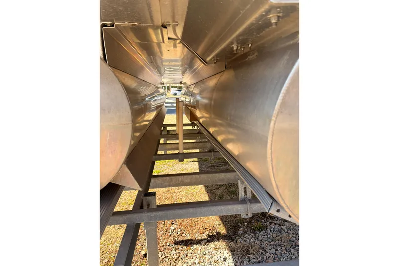 Slide: The Image of Underneath view of a 2018 Bennington 23 SSBXP pontoon boat on a trailer. - 19