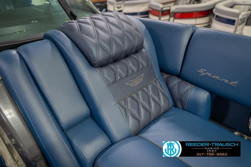 Slide: The Image of Luxurious blue leather seating in 2026 Bennington 27 RX boat, featuring diamond stitching. - 22