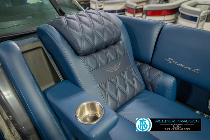 Slide: The Image of Luxurious blue seating in 2026 Bennington 27 RX boat with diamond stitching and cup holder. - 23