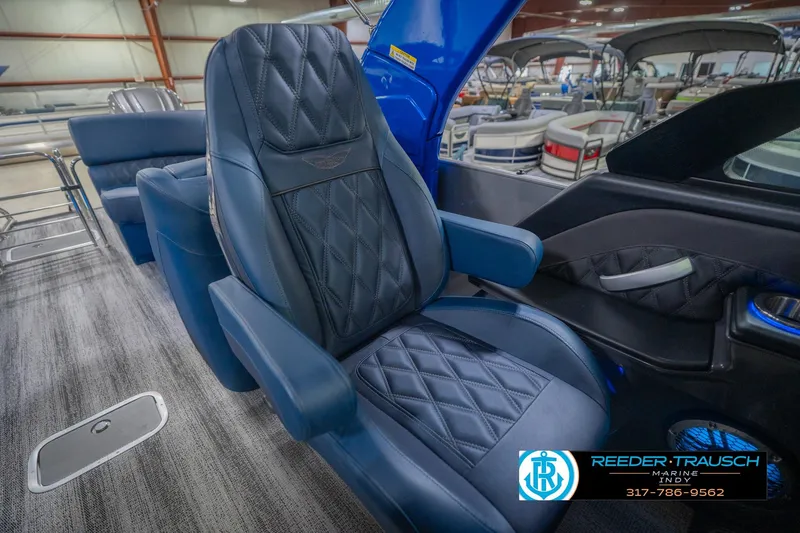Slide: The Image of Luxurious seating in 2026 Bennington 27 RX boat, featuring diamond-stitched upholstery. - 26