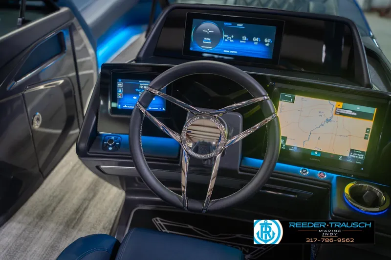 Slide: The Image of 2026 Bennington 27 RX boat dashboard with advanced navigation and control systems. - 29