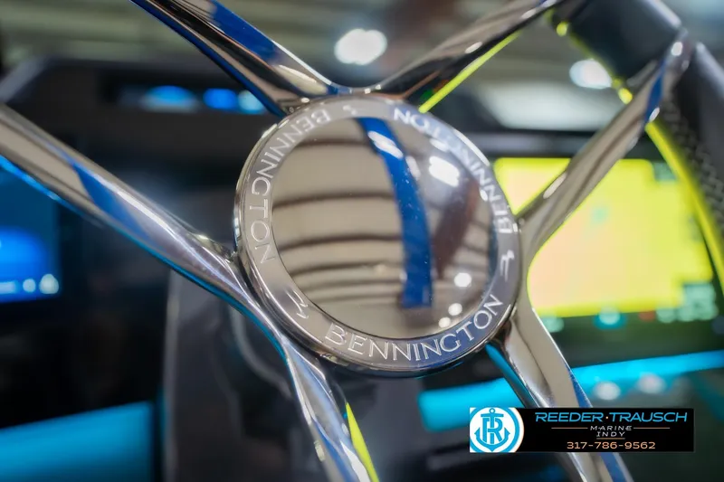 Slide: The Image of Close-up of 2026 Bennington 27 RX steering wheel with Reeder-Trausch Marine logo. - 31