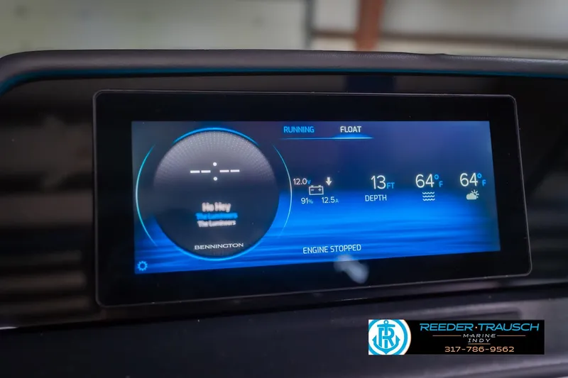 Slide: The Image of Digital display of 2026 Bennington 27 RX boat dashboard with navigation and engine data. - 33