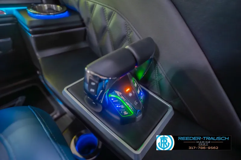 Slide: The Image of 2026 Bennington 27 RX boat interior with illuminated control panel and cup holder. - 35