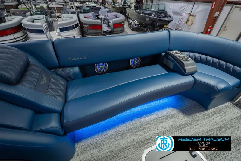 Slide: The Image of Luxurious interior of 2026 Bennington 27 RX boat with blue seating and cup holders. - 39