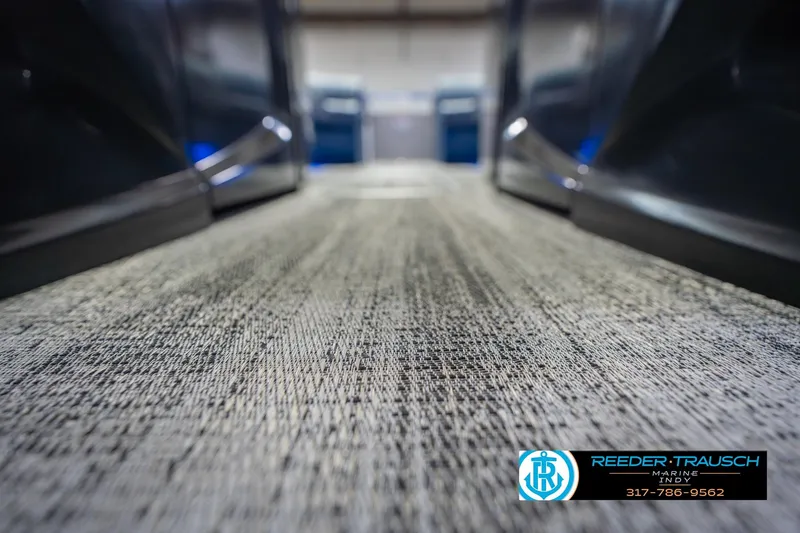 Slide: The Image of 2026 Bennington 27 RX boat interior flooring, Reeder Trausch Marine logo visible. - 46