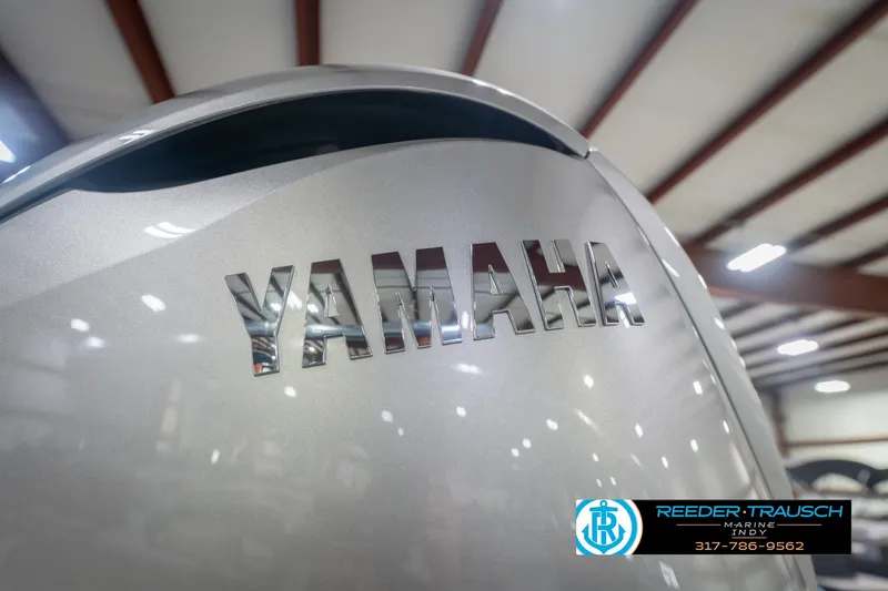 Slide: The Image of Close-up of Yamaha engine on 2026 Bennington 27 RX boat in showroom. - 48
