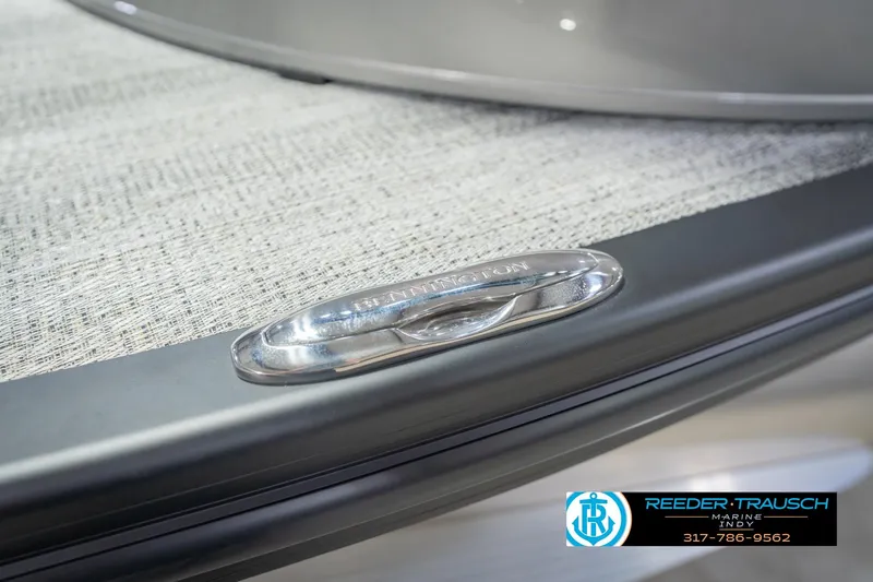 Slide: The Image of 2026 Bennington 27 RX boat detail with Reeder-Trausch Marine logo and contact information. - 54