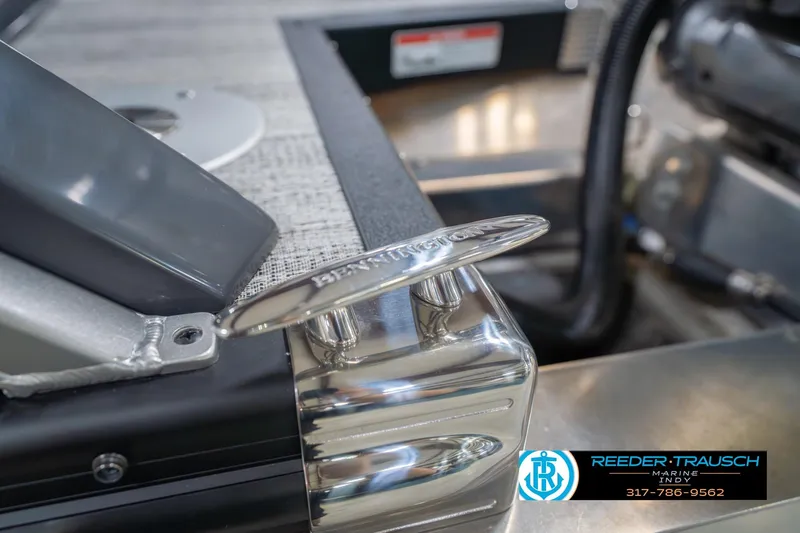 Slide: The Image of 2026 Bennington 27 RX boat cleat detail with Reeder-Trausch Marine logo. - 56