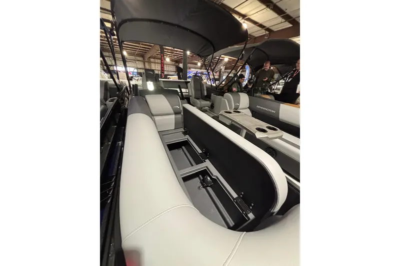 Slide: The Image of 2026 Bennington 23 SSB SF pontoon boat interior with seating and storage compartments. - 12