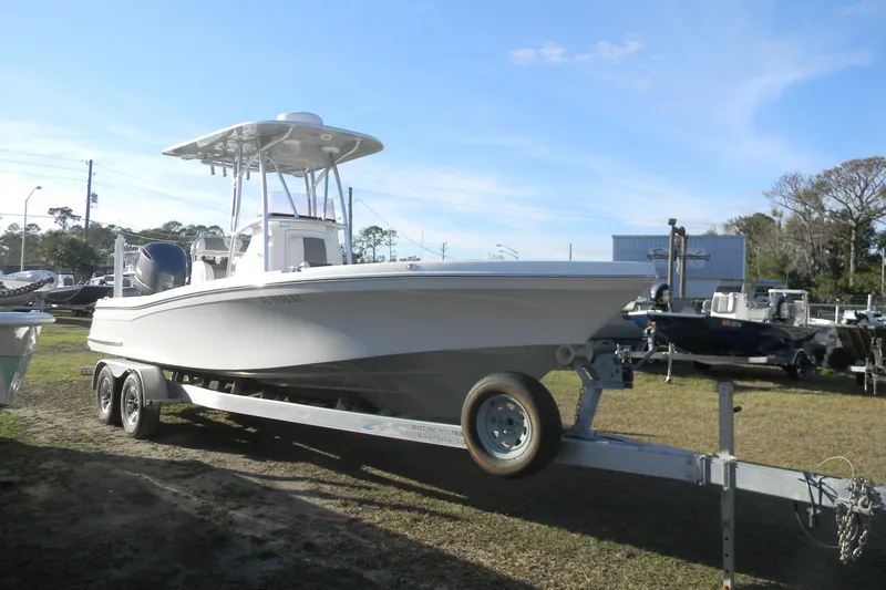 Slide: The Image of 2021 BlackJack 256 Coastal boat on trailer, parked outdoors under clear sky. - 4