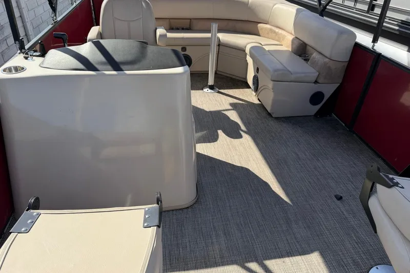 Slide: The Image of 2020 Bentley Pontoons 200 Fish interior with beige seating and helm station. - 6