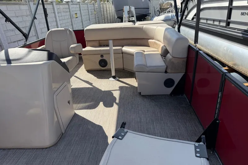 Slide: The Image of 2020 Bentley Pontoons 200 Fish interior with beige seating and steering console. - 7