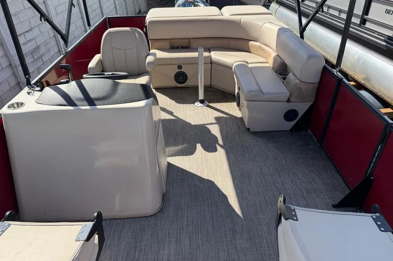 Slide: The Image of 2020 Bentley Pontoons 200 Fish interior with beige seating and helm station. - 8