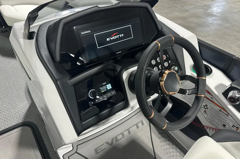 Slide: The Image of 2026 Evotti 723 QL boat dashboard with steering wheel and digital display. - 14