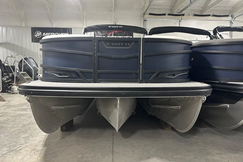 Slide: The Image of 2026 Evotti 723 QL pontoon boat in showroom, front view. - 2