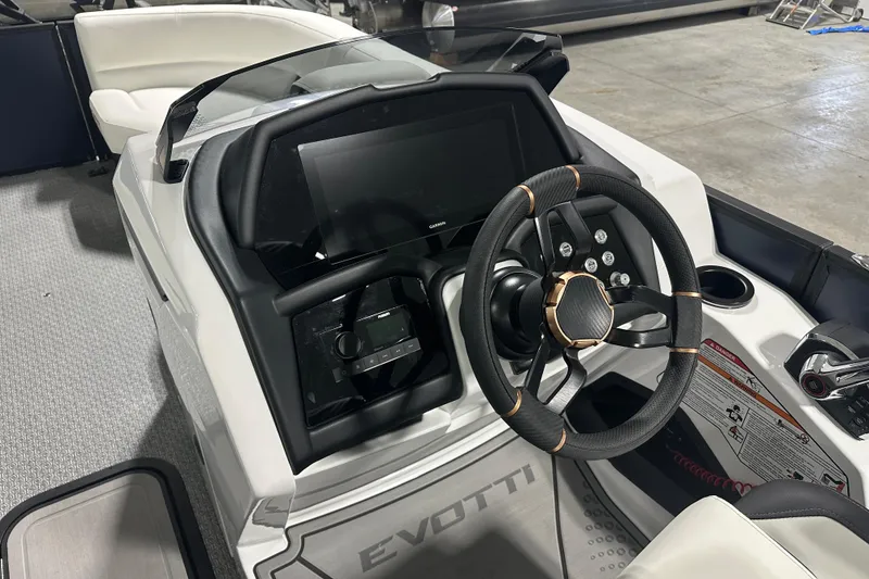 Slide: The Image of Steering console of 2026 Evotti 723 QL boat with modern dashboard and controls. - 6