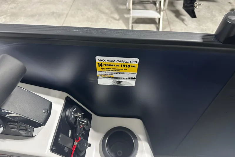 Slide: The Image of Control panel of 2026 Evotti 723 QL boat with capacity label. - 7