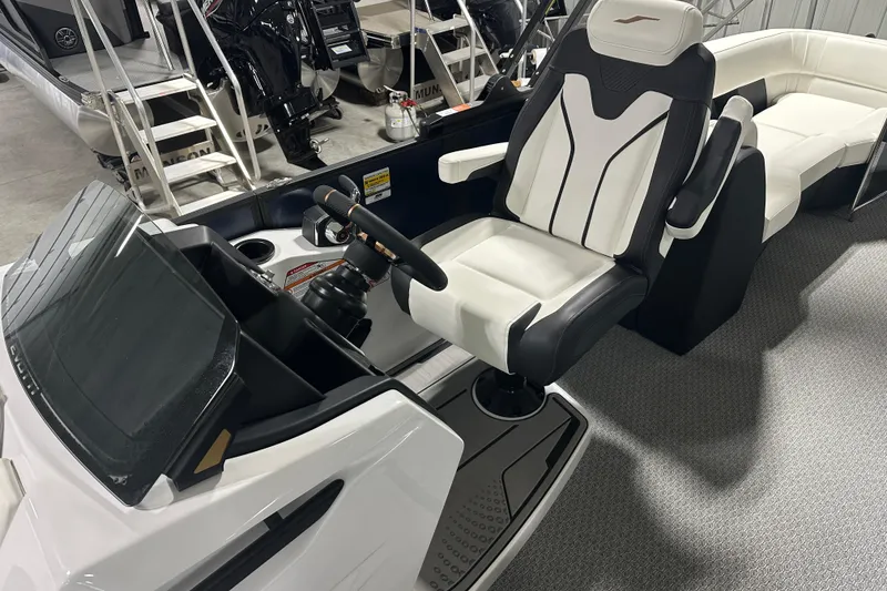 Slide: The Image of 2026 Evotti 723 QL boat interior with sleek captain's chair and modern dashboard. - 8