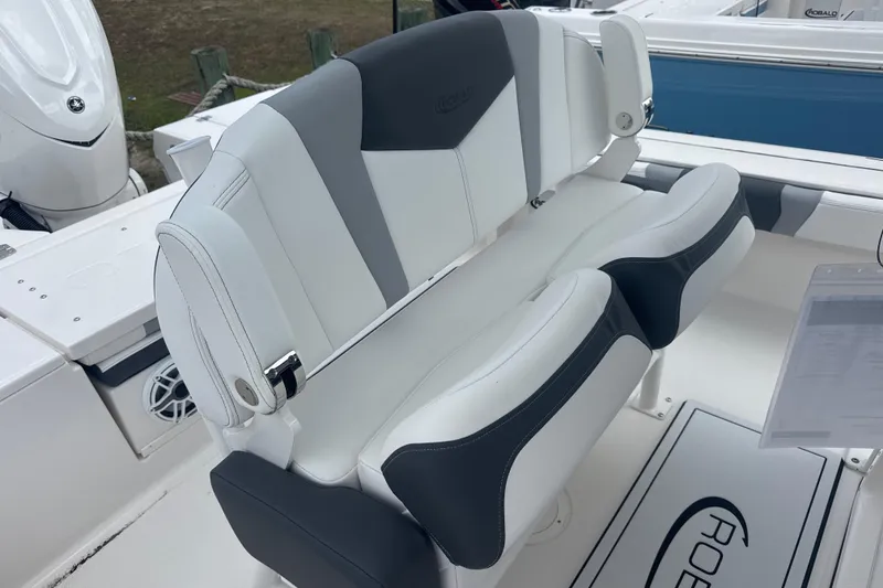 Slide: The Image of 2026 Robalo 246 Cayman boat with stylish white and gray seating. - 6