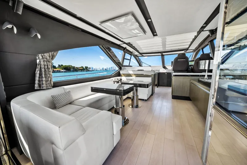 Slide: The Image of Luxurious interior of 2019 Azimut S7 yacht with modern seating and panoramic windows. - 19