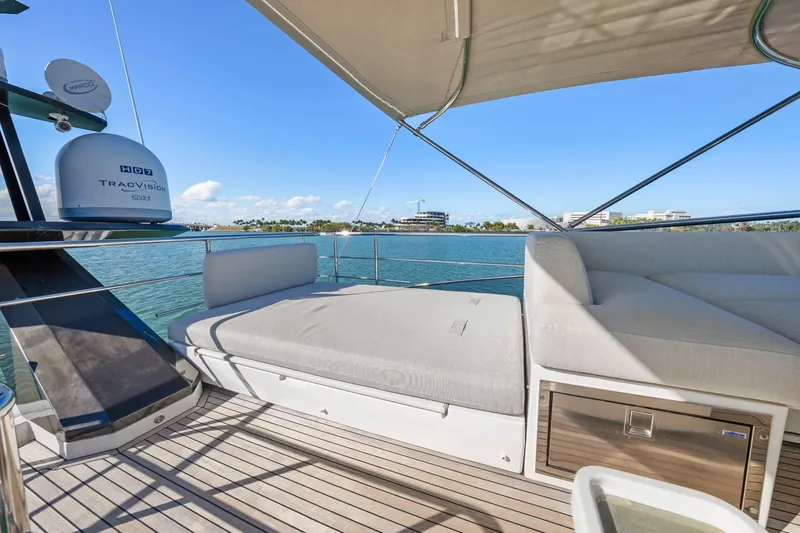 Slide: The Image of Luxurious 2019 Azimut S7 yacht deck with comfortable seating and scenic waterfront view. - 27