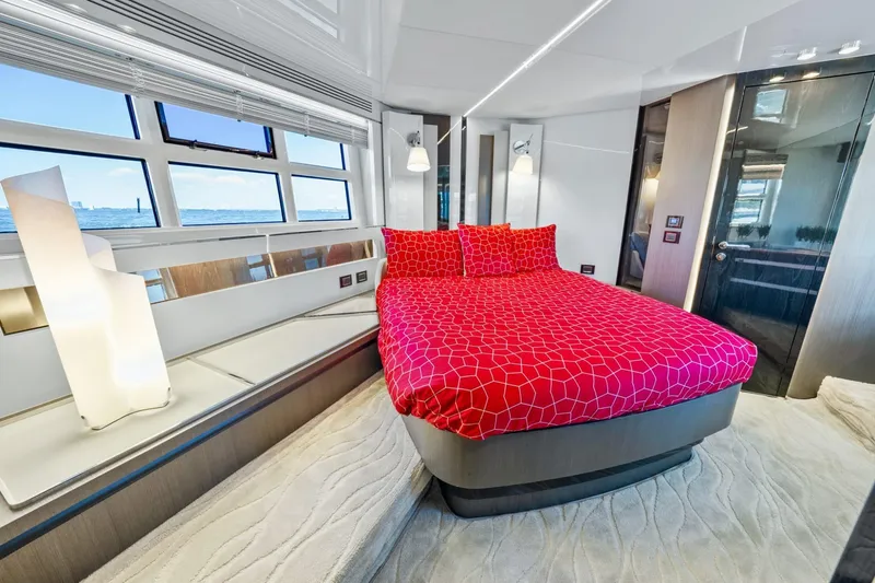 Slide: The Image of Luxurious 2019 Azimut S7 yacht bedroom with red bedding and ocean view windows. - 41