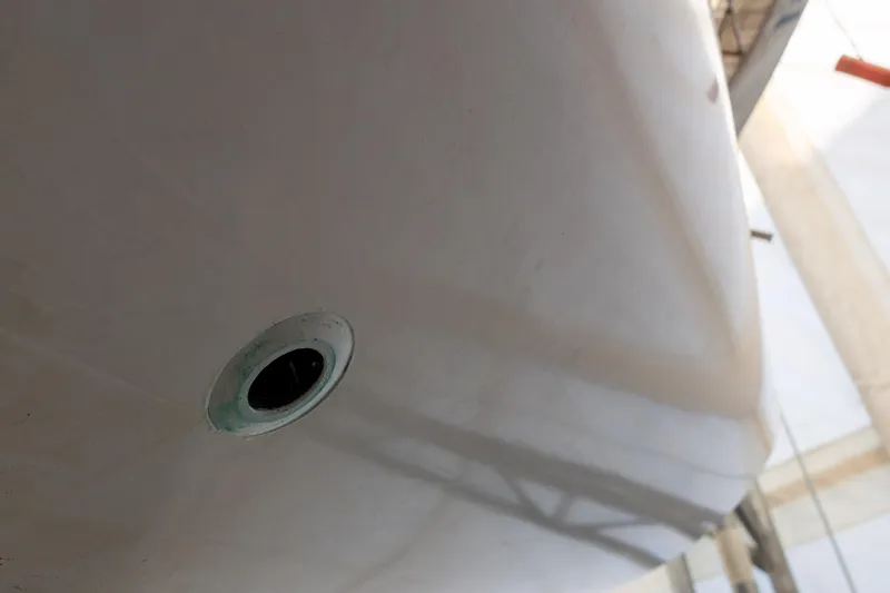 Slide: The Image of Close-up of a 1965 Concordia 39 boat hull with a visible drain hole. - 15