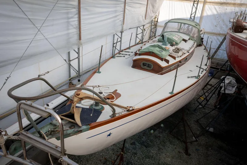 Slide: The Image of 1965 Concordia 39 sailboat in dry dock, covered and undergoing maintenance. - 16