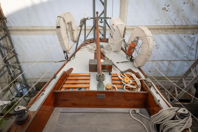 Slide: The Image of Restored 1965 Concordia 39 sailboat deck with lifebuoys and ropes in a covered area. - 21