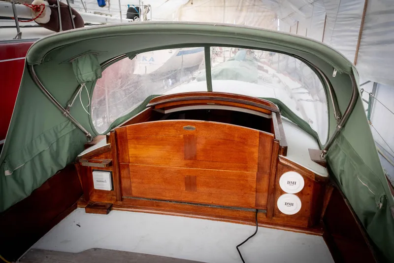 Slide: The Image of Cockpit of 1965 Concordia 39 sailboat with green canopy and wooden hatch. - 23