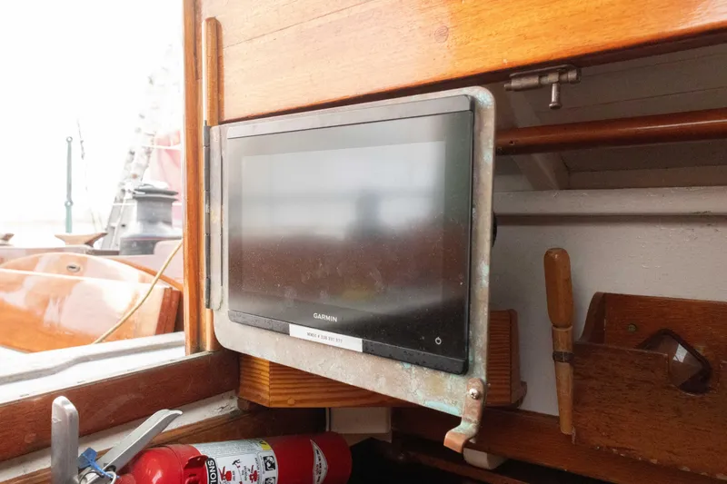 Slide: The Image of Garmin navigation system on 1965 Concordia 39 sailboat, with fire extinguisher nearby. - 28