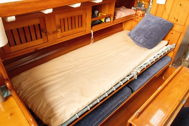 Slide: The Image of Wooden interior of 1965 Concordia 39 sailboat with a cozy bunk bed. - 34