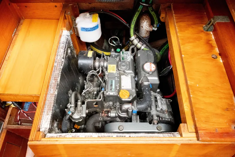 Slide: The Image of Engine compartment of a 1965 Concordia 39 sailboat, showcasing detailed mechanical components. - 35