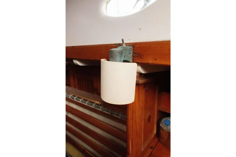 Slide: The Image of Vintage Concordia 39 interior detail, showcasing wooden cabinetry and a mounted fixture, 1965 model. - 36