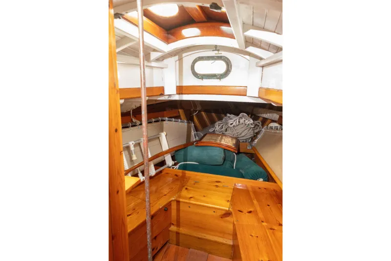 Slide: The Image of Interior of a 1965 Concordia 39 sailboat with wooden furnishings and nautical decor. - 39